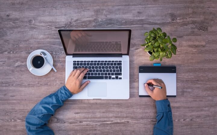 freelancer working on laptop at home