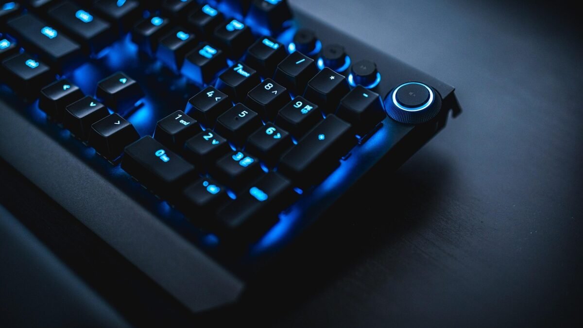 gamer playing mmorpg at night with rgb keyboard