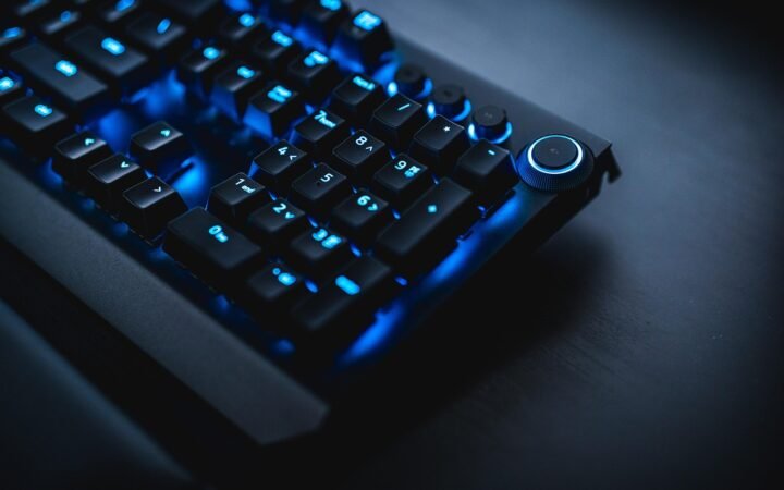 gamer playing mmorpg at night with rgb keyboard