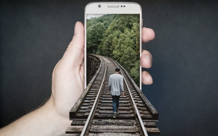 person recording product video smartphone home